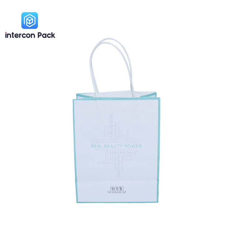 China 120gsm White Flat Bottom Paper Bags Bioldegradable Shopping Paper Bags With Logo on sale