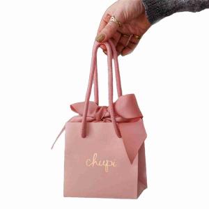 China Recycled Small Pink Cardboard Printed Paper Gift Bags Ribbon Handle Bags on sale
