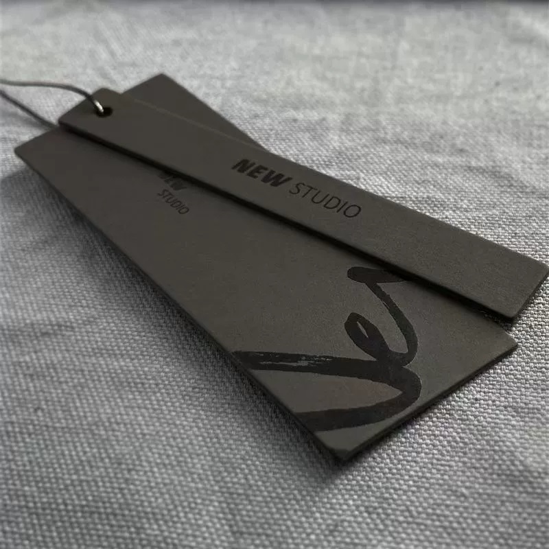 Multi-Layer Black Paper Hang Tags With Spot UV Finish For Apparel Branding