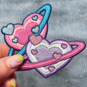 China Custom Heart Planet Cute Space Embroidered Iron On Patch Twill Fabric Background on sale