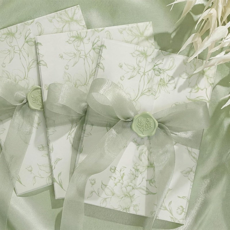 Custom vellum jacket wedding invitation cards with wax seal and ribbon