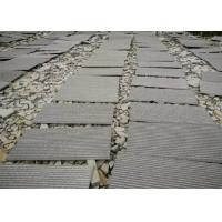 China Hainan Black Lava Sands Blasted Bluestone Black Dark Basalt Flamed Grooved Natural Stone Tiles Slabs for sale